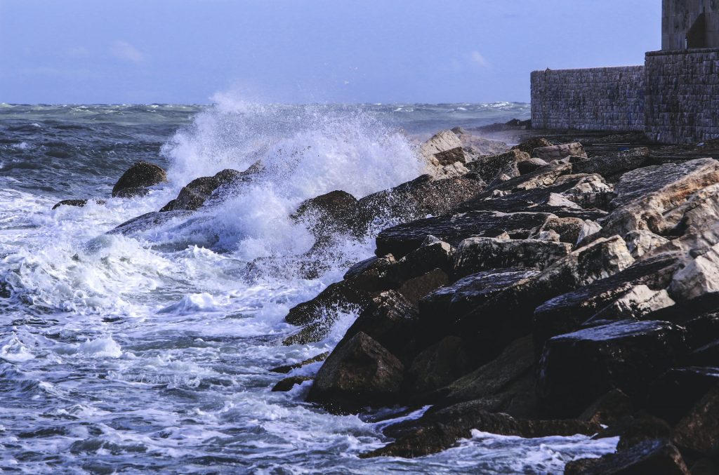 trademark opposition - image of a rocky shore being crashed with waves, a visual metaphor