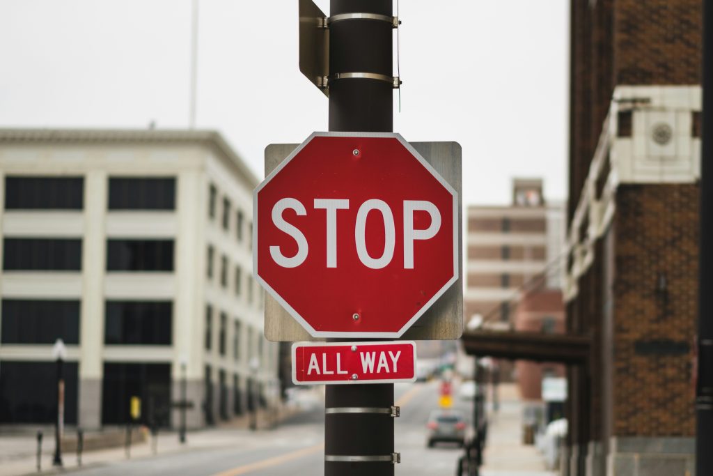 Cease and desist letters for intellectual property: what to do next. An image of a red stop sign on a quiet street.